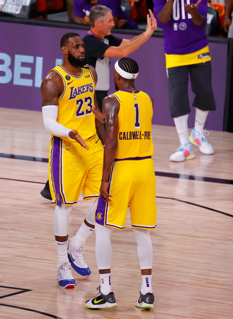 LeBron James (23) of the Los Angeles Lakers talks with teammate Kentavious Caldwell-Pope (1) during a game against the Denver Nuggets.