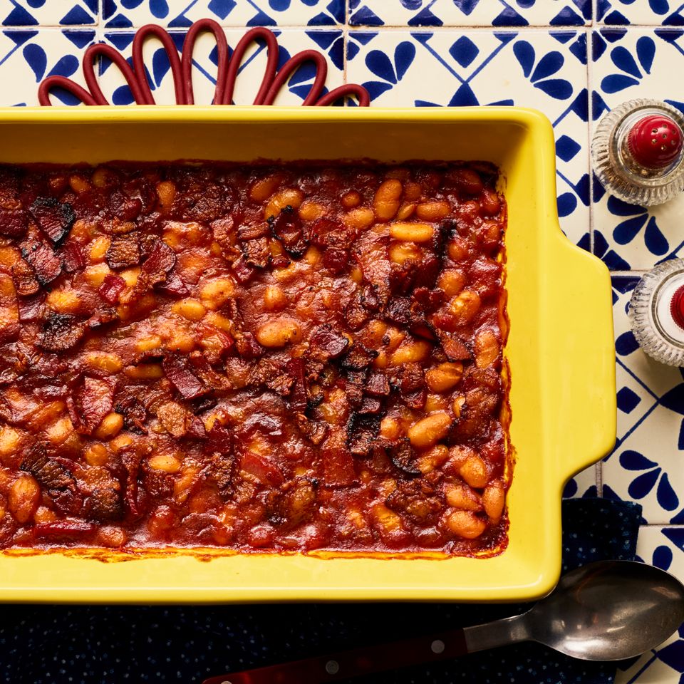 Baked bean casserole in yellow baking pan Credit: Photographer: Victor Protasio, Food Stylist: Karen Rankin