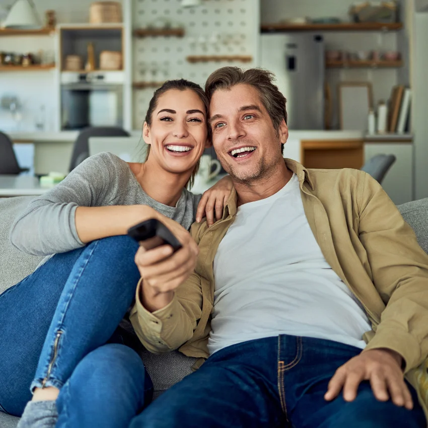 couple laughing while watching the office
