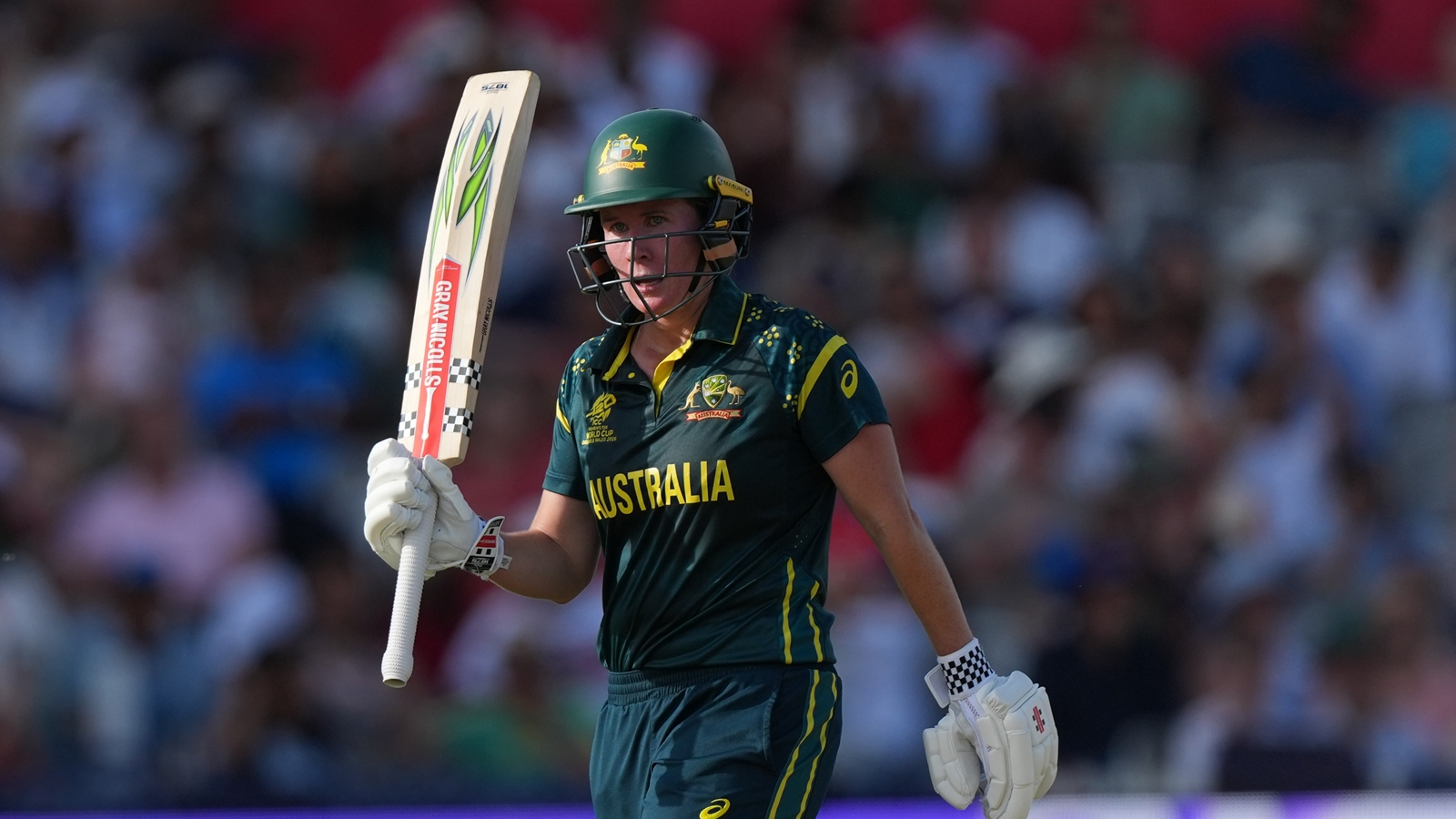 Australia's Beth Mooney, celebrates getting 50 not out during the Women's T20 Cricket World Cup final between England and Australia in London, Sunday, July 5, 2026. (AP Photo/Alastair Grant)