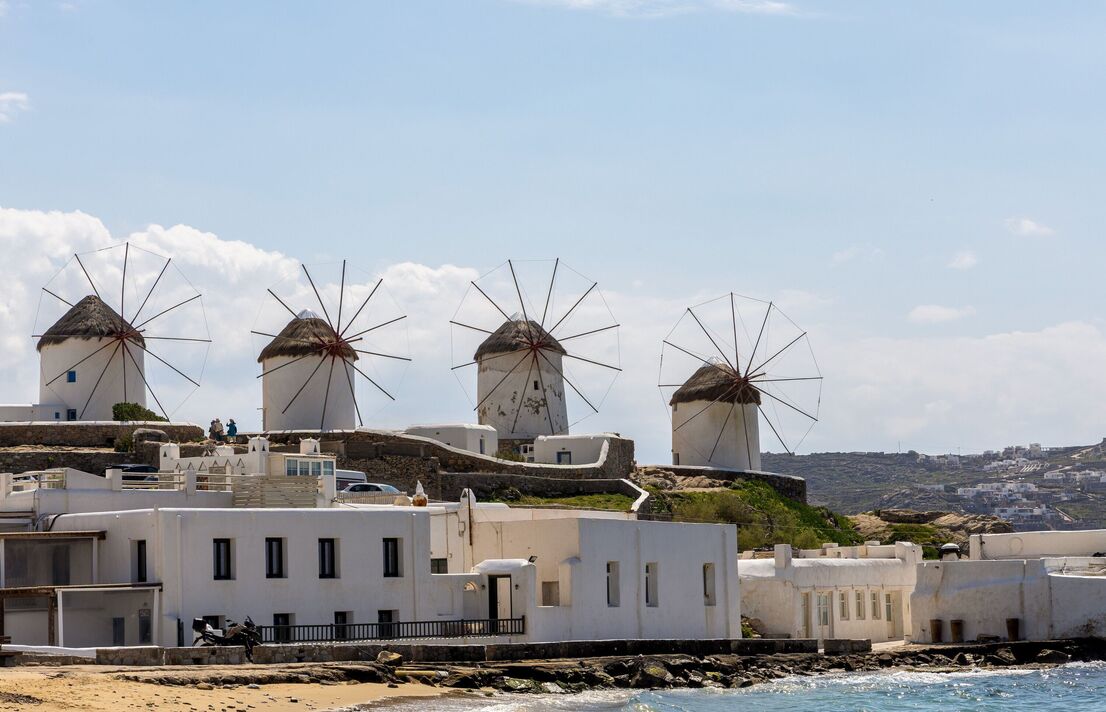Scenic view. Famous Mykonos town windmills. Traditional Greek windmills on Mykonos island, Greece Scenic view. Famous Mykonos town windmills. Traditional Greek windmills on Mykonos island, Greece