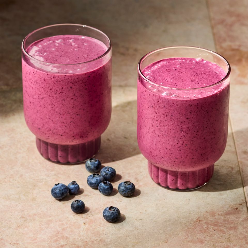 a recipe photo of a Blueberry-Peach Chia Seed Smoothie Credit: Photographer: Victor Protasio, Food Stylist: Chelsea Zimmer, Prop Stylist: Hannah Grennwood.