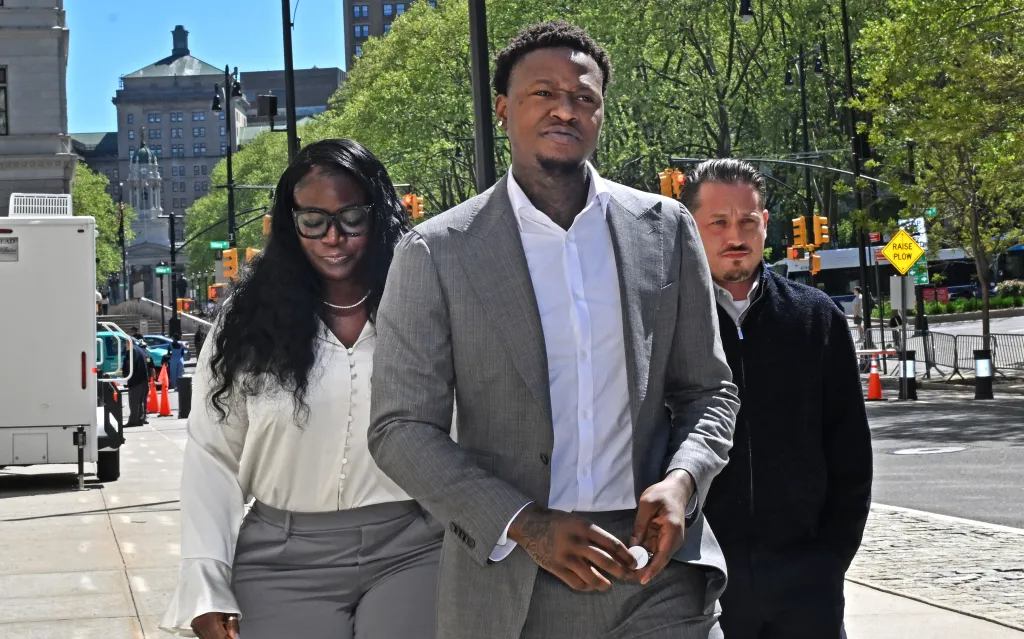 Terry Rozier (pictured, grey suit) arriving at Brooklyn federal court.