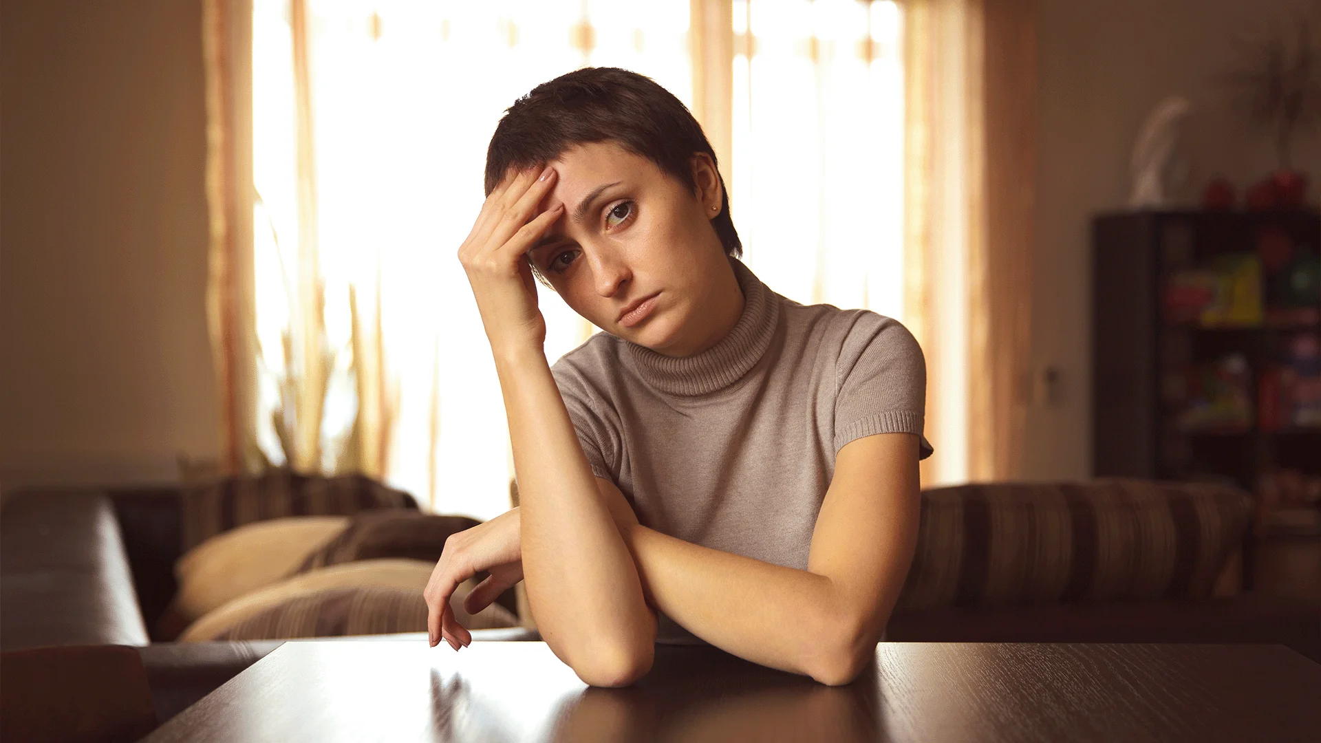 mentally and emotionally numb woman says 'I just need to get through this week'