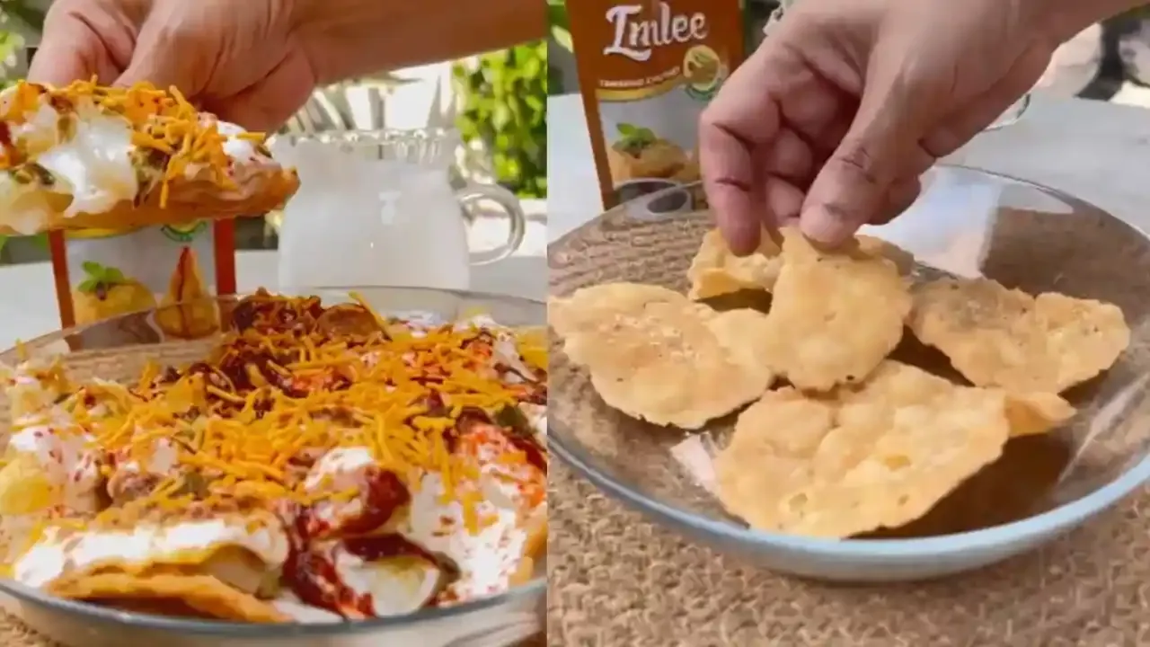 Crispy papdi chaat topped with creamy yogurt, tangy tamarind chutney, and crunchy sev for a delicious snack experience.