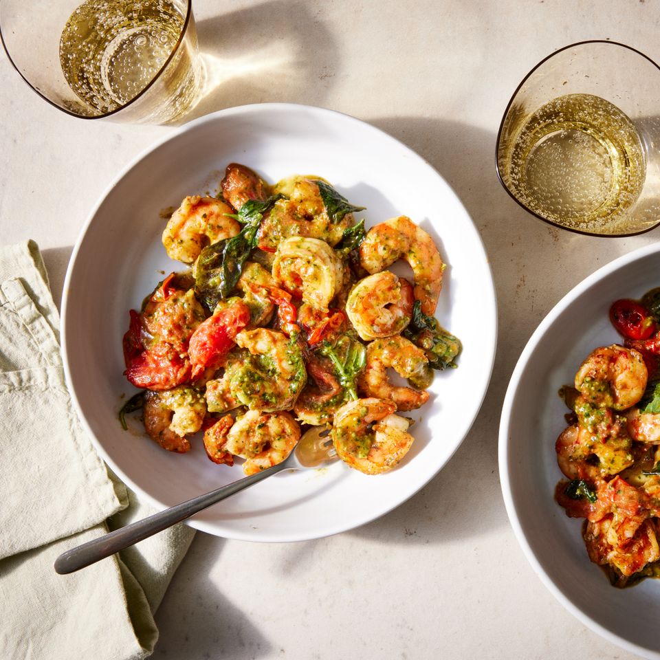 The 15-minute pesto shrimp recipe on a white plate Credit: Photographer: Jen Causey, Food Stylist: Ana Kelly, Prop Stylist: Claire Spollen