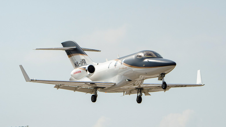 HondaJet with landing gear extended coming in to land.
