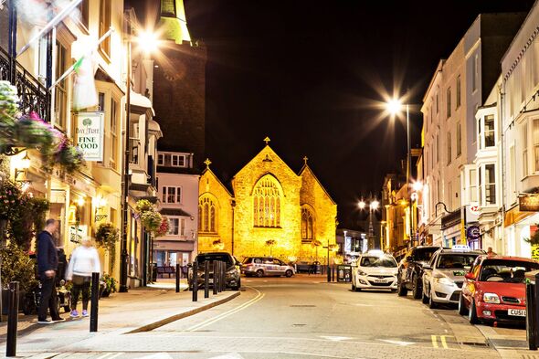 view of St Mary's Church at night from St Julian's St, Tenby, UK view of St Mary's Church at night from St Julian's St, Tenby, UK