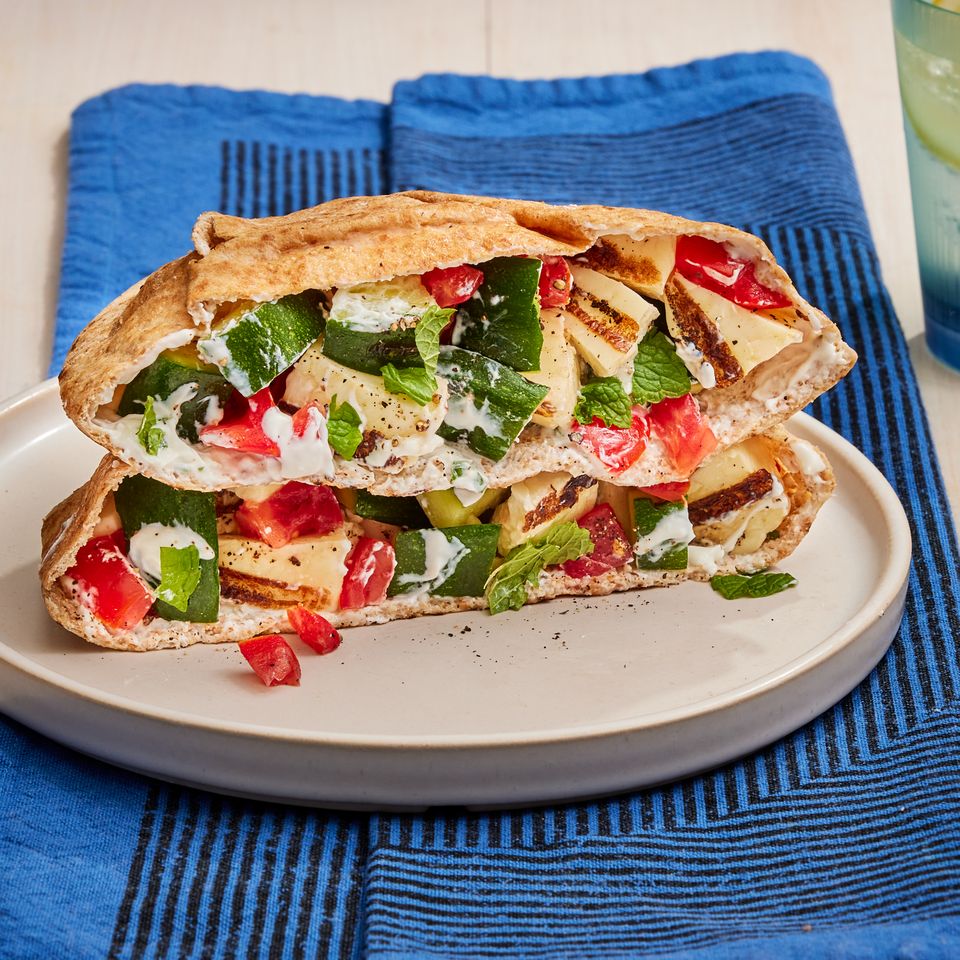 a recipe photo of the Grilled Zucchini & Halloumi Stuffed Pitas Credit: Photographer: Robby Lozano, Food Stylist: Margaret Dickey, Prop Stylist: Julia Bayless