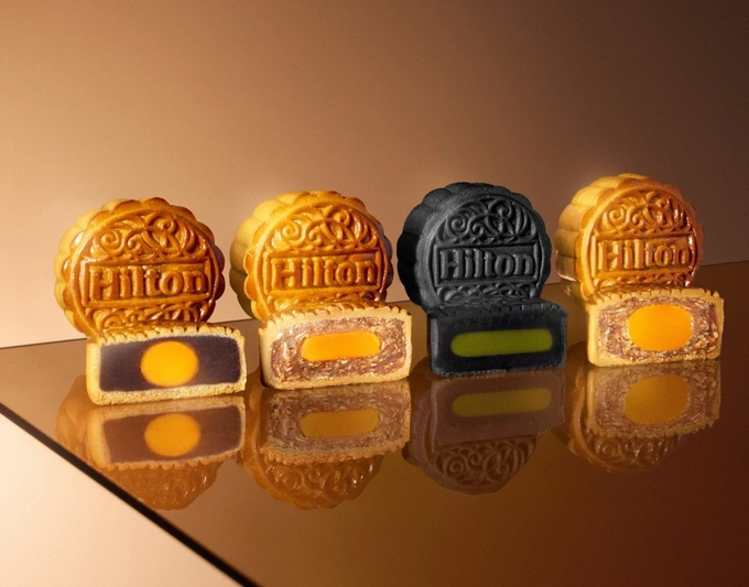 (From L) This year’s mooncake flavors: red bean with salted egg yolk; seafood with XO Sauce; bamboo charcoal green tea; and roasted chicken with jambon sauce. Photo courtesy of Hilton Saigon