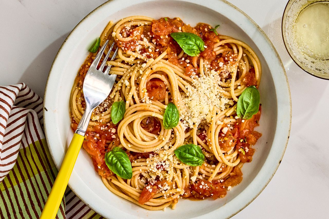 A recipe image of Easy Pasta with Tomato Sauce Credit: Photographer: Robby Lozano, Food Stylist: Lauren Odum, Prop Styling: Josh Hoggle