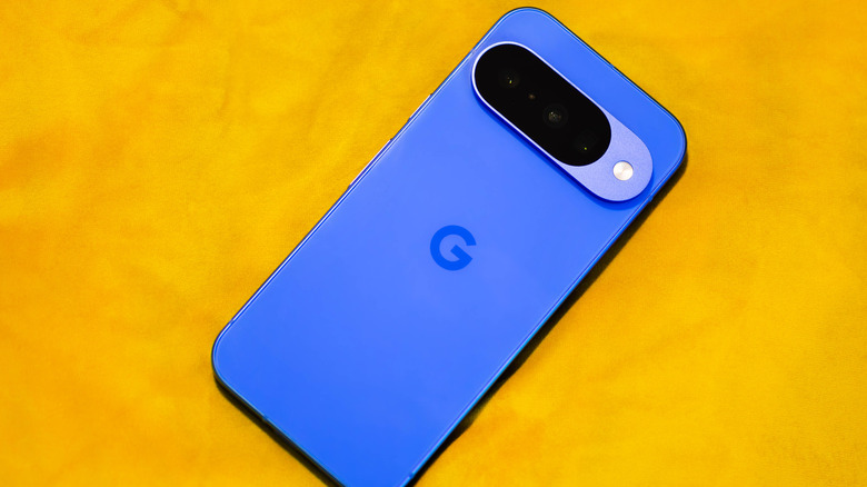 Blue Google Pixel 10 on a yellow surface