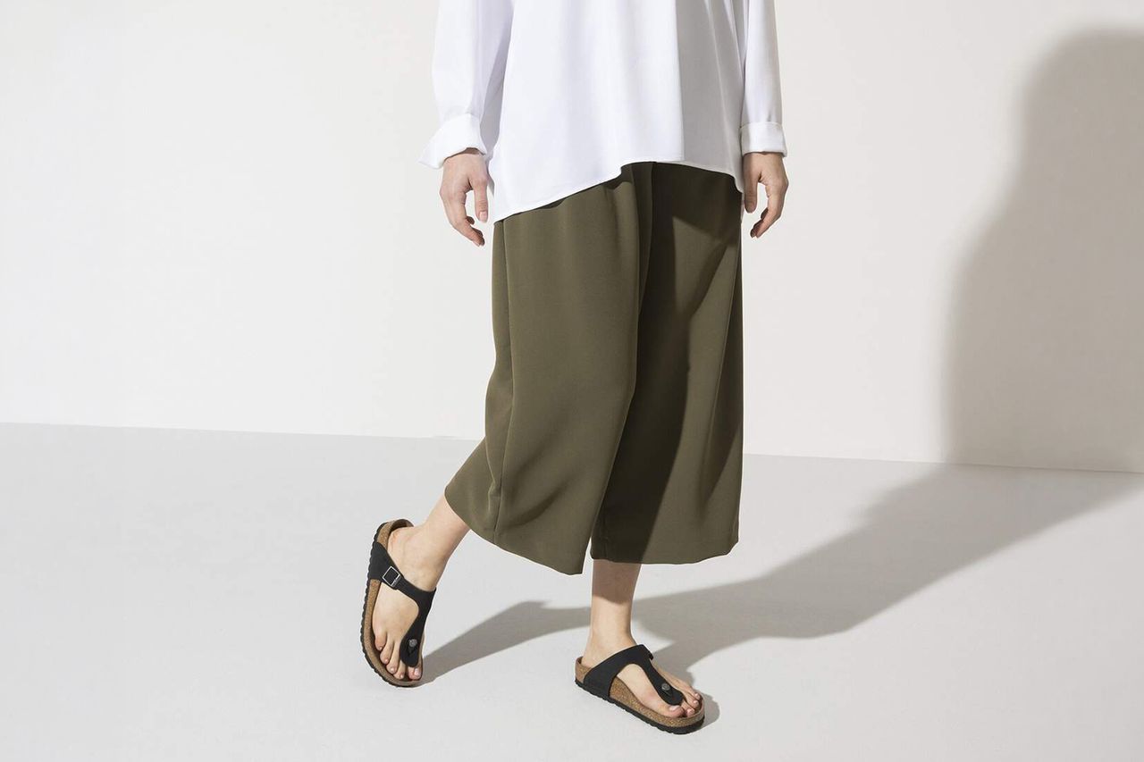 Person wearing Birkenstock Gizeh vegan sandals and loose clothing Credit: Birkenstock