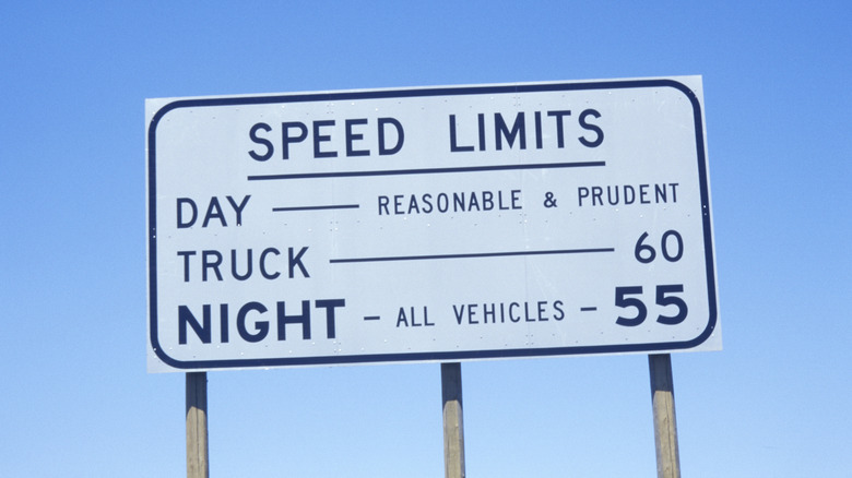 A large sign showing multiple speed limits for different driving scenarios.