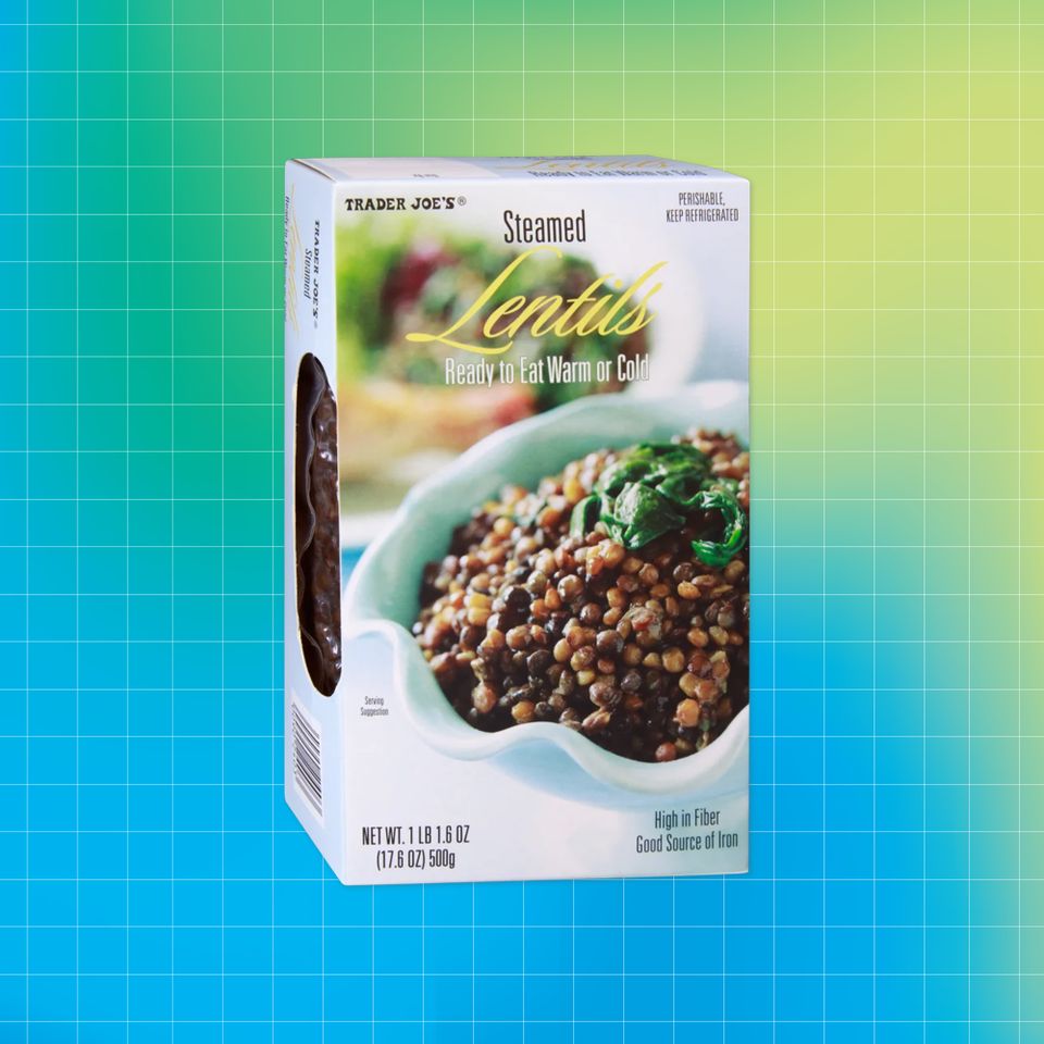 Box of Trader Joes Steamed Lentils positioned against a gradient background Credit: Trader Joe's. Getty Images. EatingWell design.