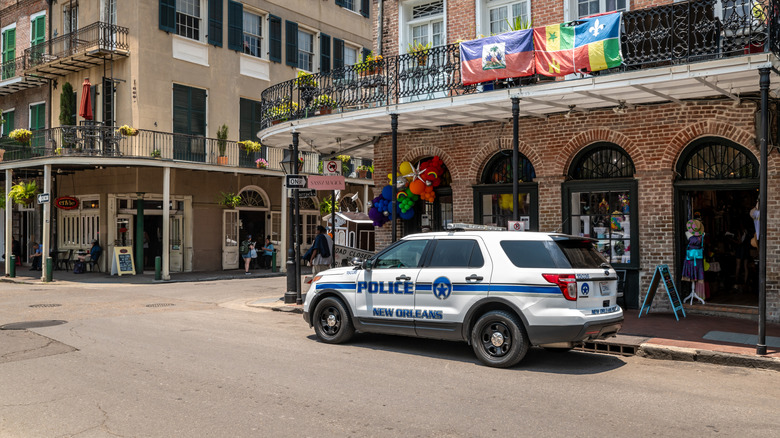 Police car parked on a New Orleans street.