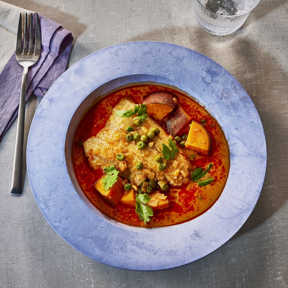 Image of Red Thai Curry Poached Cod in a bowl Credit: Heami Lee, Food Stylist: Emily Nabors Hall, Prop Stylist: Christine Keeley