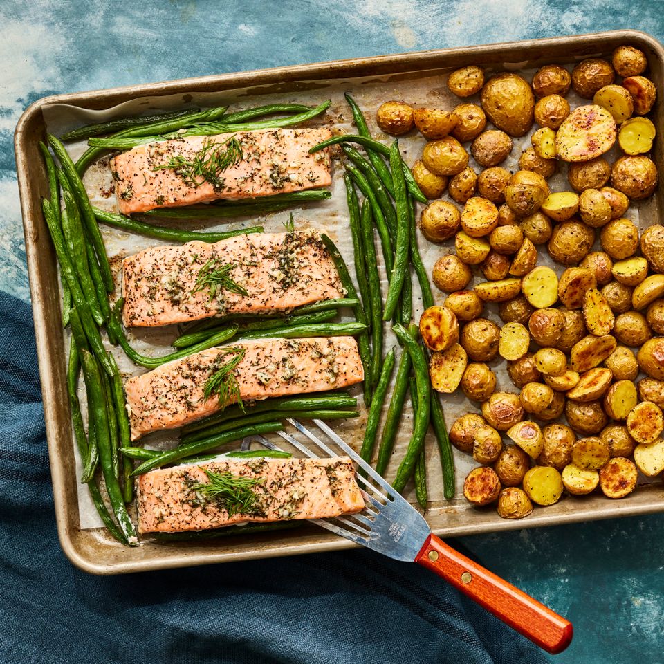 a recipe photo of the Lemon-Garlic Sheet Pan Salmon with Potatoes & Green Beans Credit: Photographer: Victor Protasio, Food Stylist: Sally McKay, Prop Stylist: Hannah Greenwood
