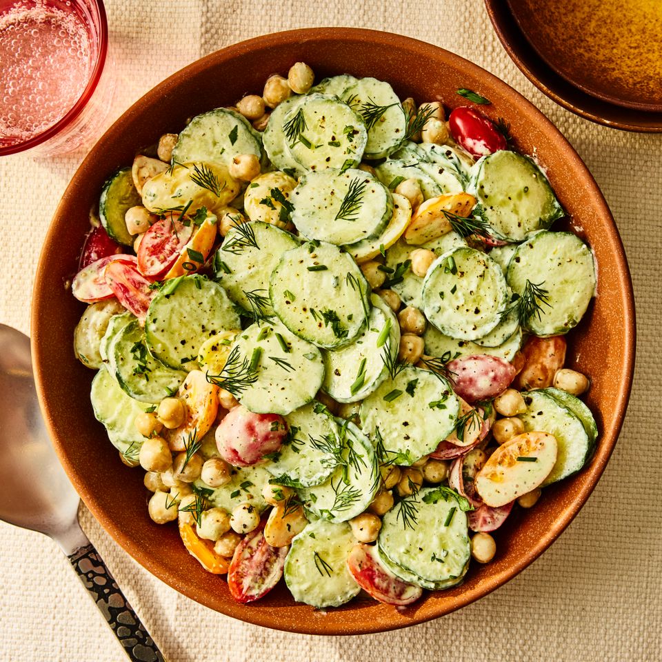 A recipe image of High-Protein Creamy Cucumber-Tomato Salad with Feta & Chickpeas. Credit: Photographer: Morgan Hunt Ward.