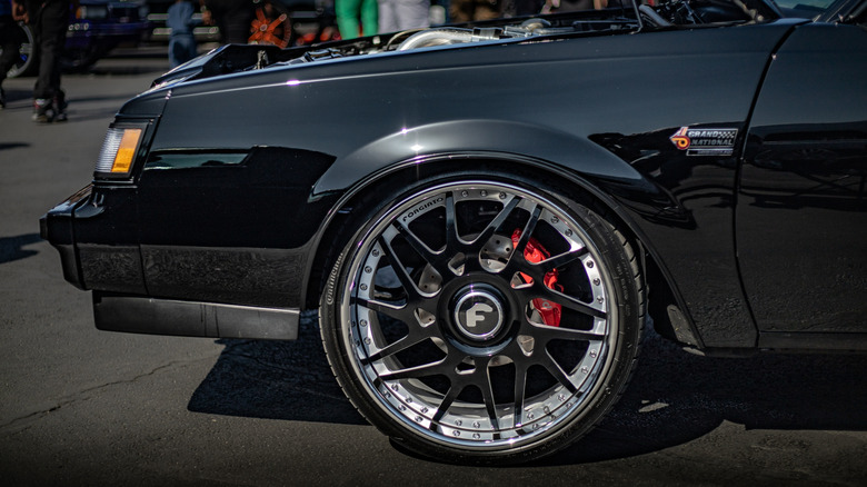 Close up view of fender and wheel on modified Buick Grand National.