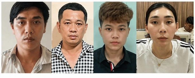 From L: meaningful scammers Duong Hoang Van, Le Van Ca, Lam Quoc Kiet and Truong Thuy Duong seen at a police station. Photo by Duong Dong
