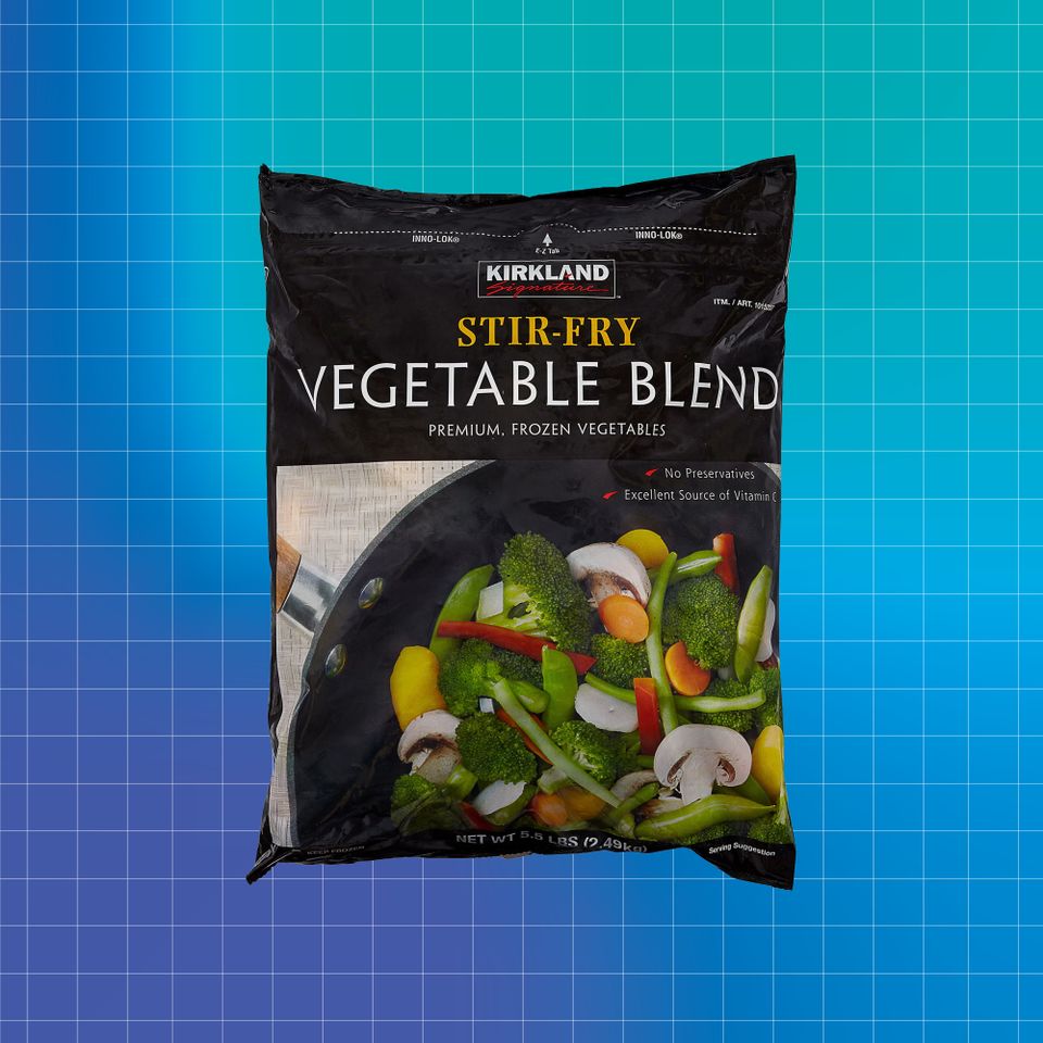 Bag of Kirkland StirFry Vegetable Blend against a blue background Credit: Costco. Getty Images. EatingWell design.