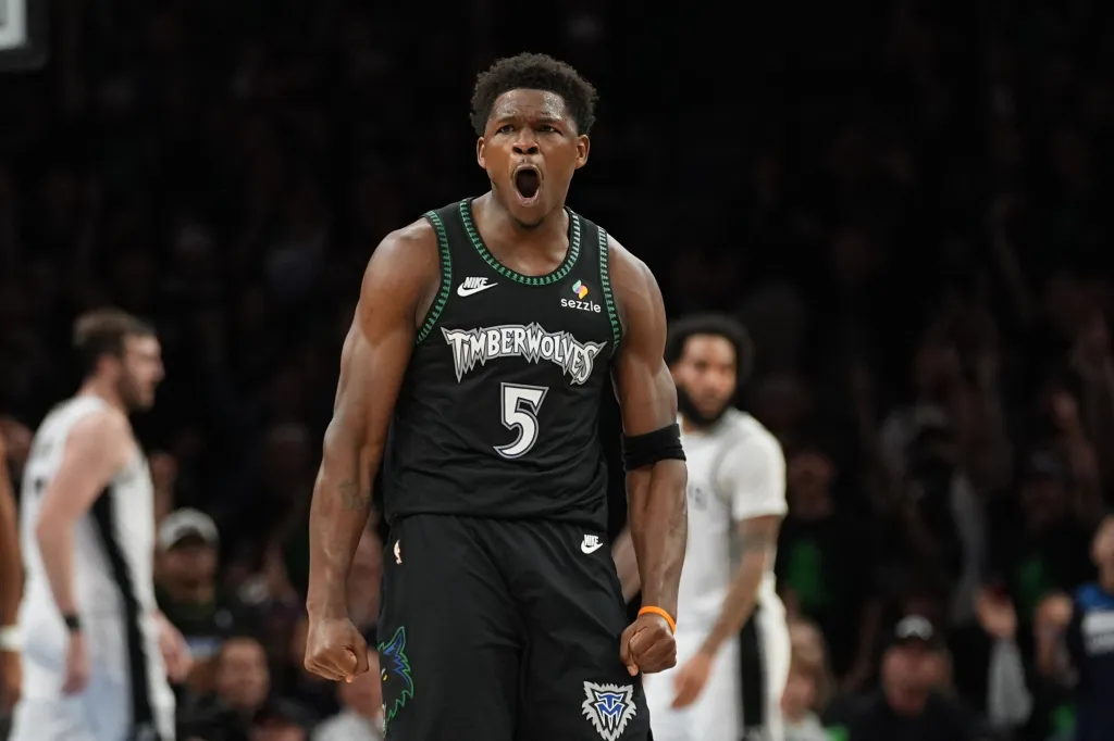 Anthony Edwards reacting after scoring a basket.