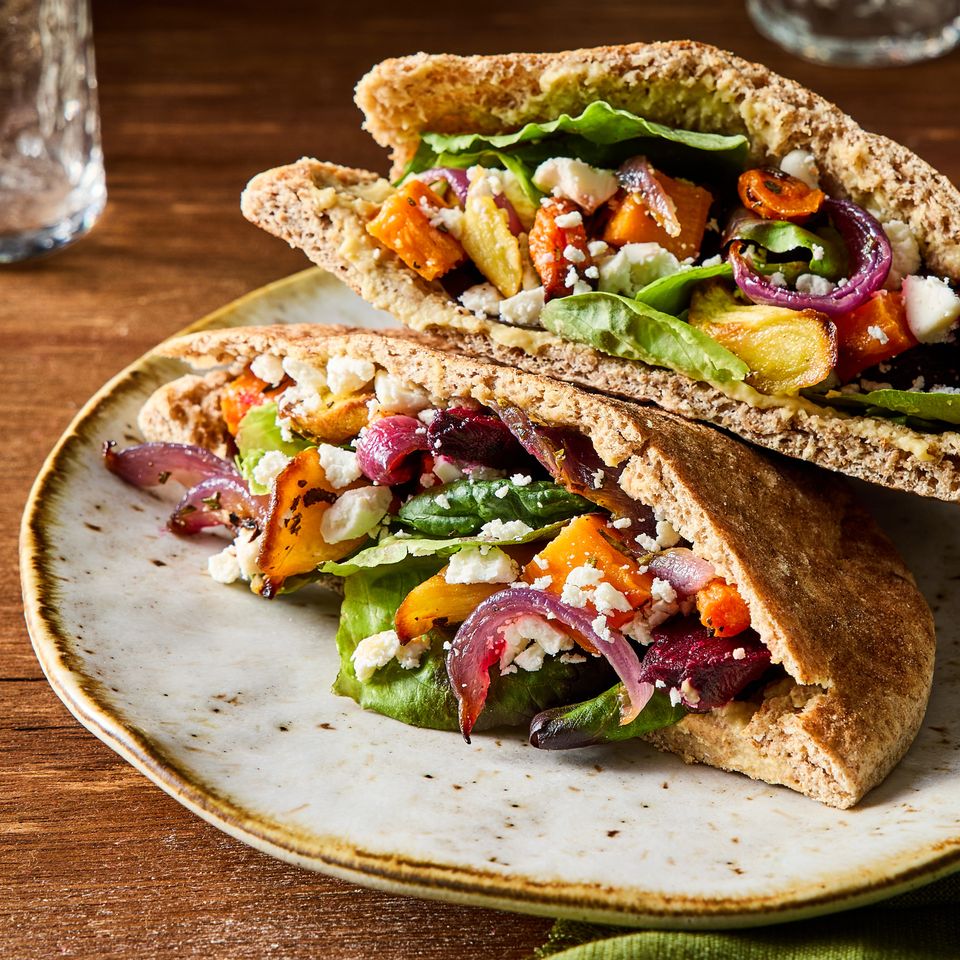 A recipe image of Roasted Veggie & Hummus Pita Pockets. Credit: Photographer: Kelsey Hansen, Prop Stylist Natalie Ghazali, Food Stylist: Shannon Goforth.