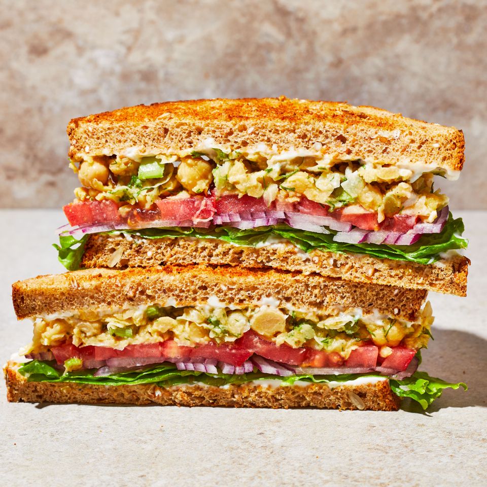 The chickpea salad sandwich recipe, cut in half so you can see the layers of filling Credit: Photographer: Caitlin Bensel, Food Stylist: Ruth Blackburn