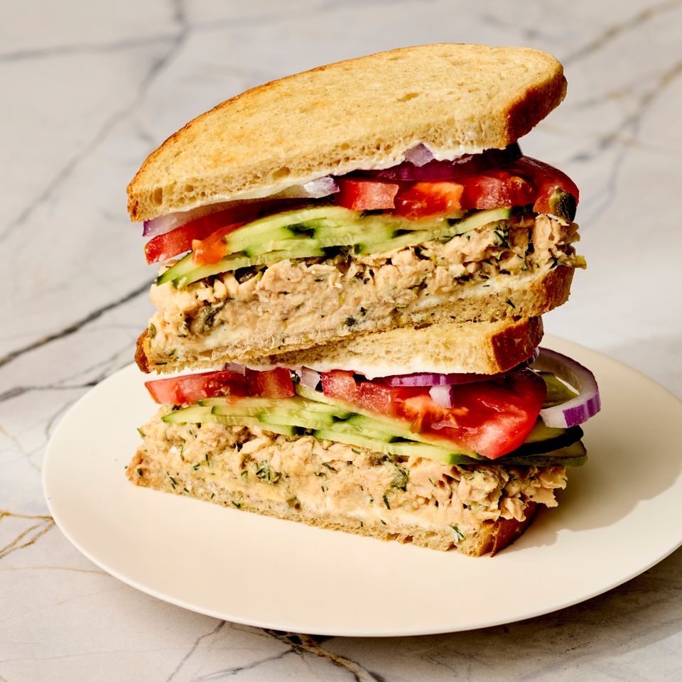 a recipe photo of Cucumber-Salmon Salad Sandwich Credit: Photographer: Victor Protasio, Food Stylist: Chelsea Zimmer, Prop Stylist: Hannah Grennwood.