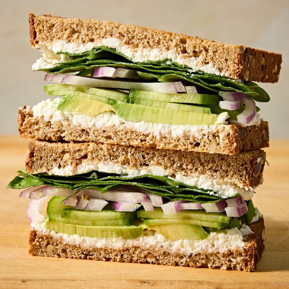 A recipe image of Cucumber-Avocado Sandwich. Credit: Photographer: Jen Causey, Food Stylist: Chelsea Zimmer, Prop Stylist: Claire Spollen.