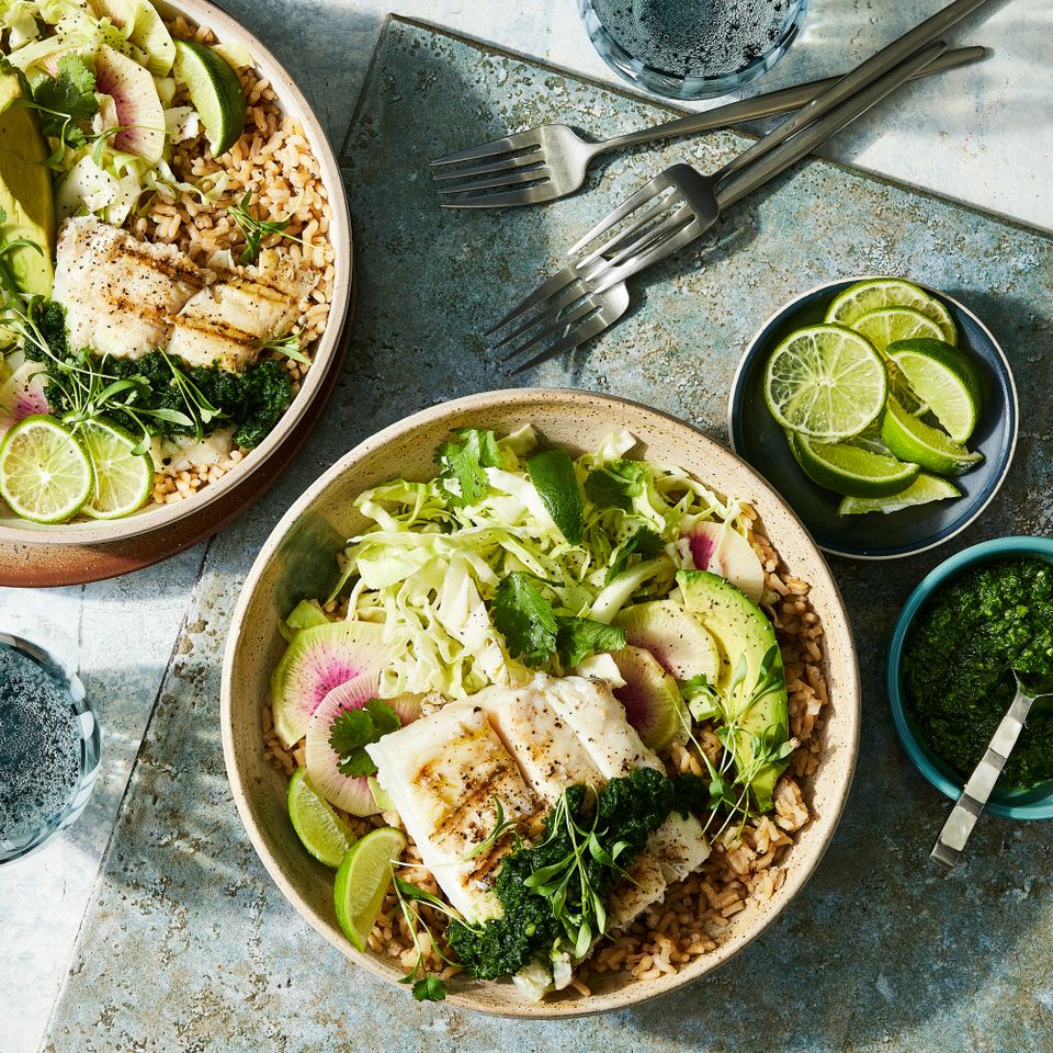 a recipe photo of the Fish Taco Bowls with Green Cabbage Slaw Credit: Photographer: Jen Causey, Food Stylist: Margret Monroe Dickey, Prop Stylist: Christine Keely