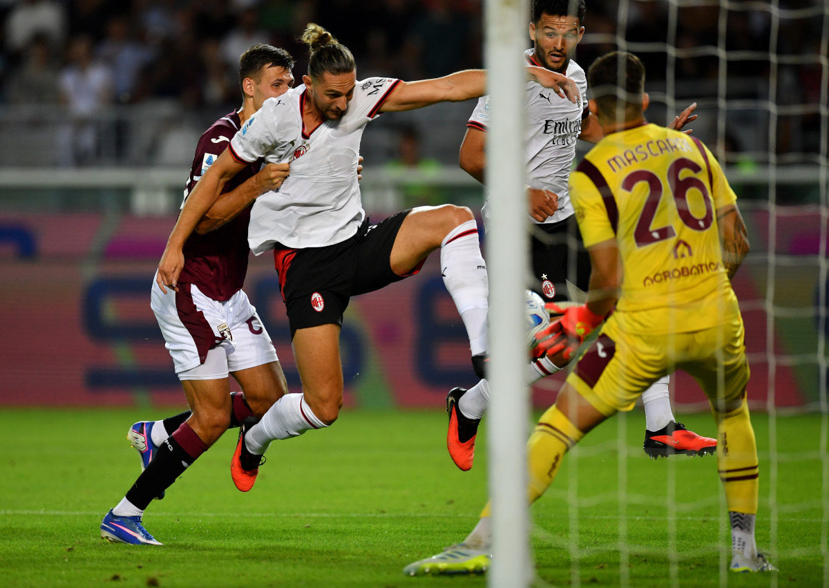 TURIN, ITALY - AUGUST 23: Adrien Rabiot of AC Milan scores his team’s second goal past Diego Mascardi of Torino FC during the Serie A match between Torino FC and AC Milan at Stadio Olimpico Grande Torino on August 23, 2026 in Turin, Italy. (Photo by Valerio Pennicino/Getty Images)