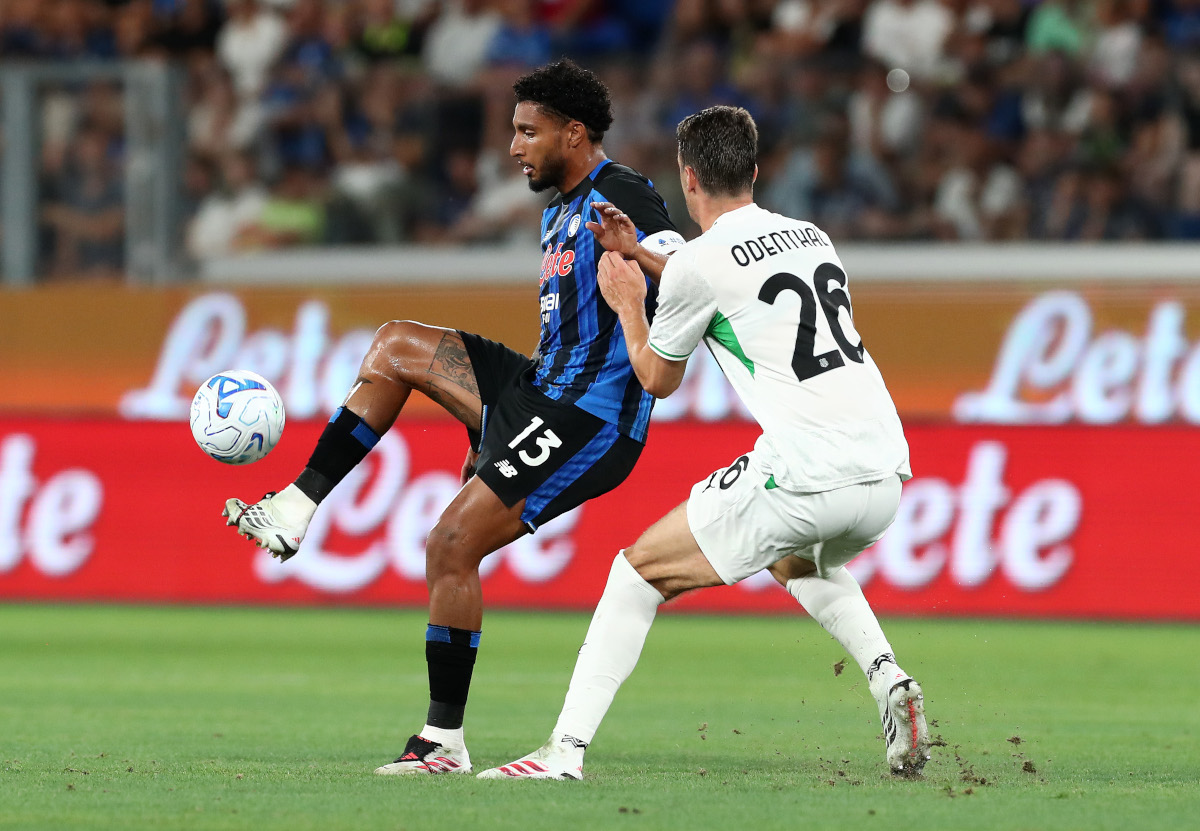 BERGAMO, ITALY - Atalanta's Ederson has been challenged by Sassuolo's Cas Odenthal during the Serie A match between Atalanta BC and US Sassuolo at the Stadio Atleti Azzurri d'Italia on August 23, 2026 in Bergamo, Italy. (Photo by Marco Luzzani/Getty Images)
