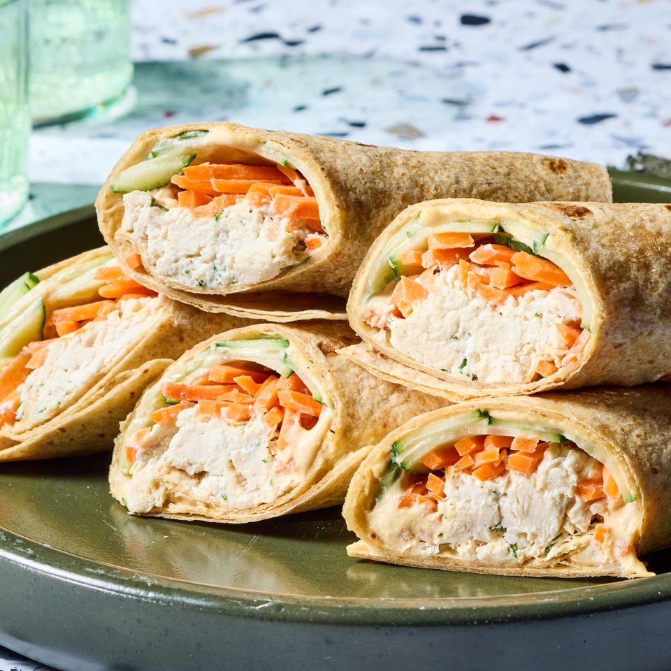 A recipe image of Chicken, Cucumber & Hummus Wrap Credit: Photographer: Grant Webster, Food Stylist: Holly Dreesman, Prop Stylist: Dera Burreson.
