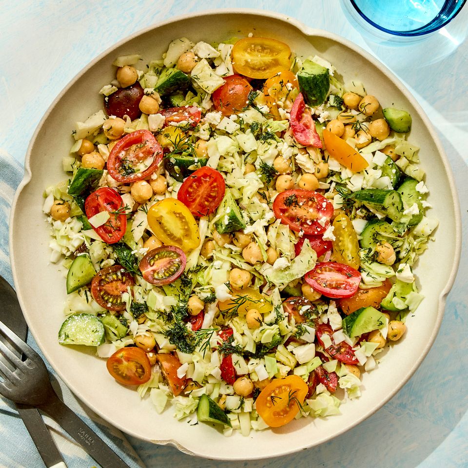 A recipe image of Chickpea, Cabbage & Cucumber Salad Credit: Photographer: Robby Lozano, Food Stylist: Lauren Odum, Prop Stylist: Josh Hoggle.