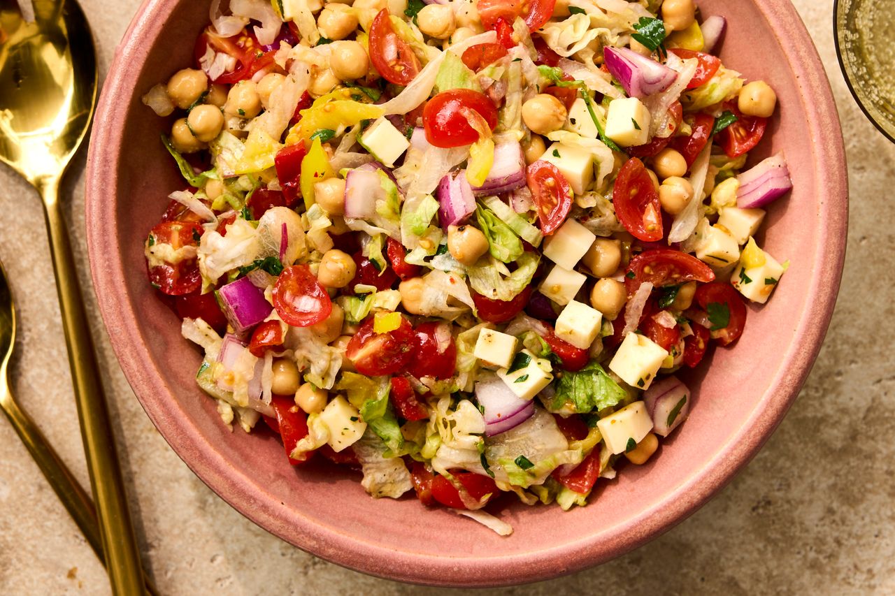 A recipe image of Chopped Italian Chickpea Salad. Credit: Photographer Victor Protasio, Food Stylist Emily Nabors Hall, Prop Stylist Phoebe Hauser.