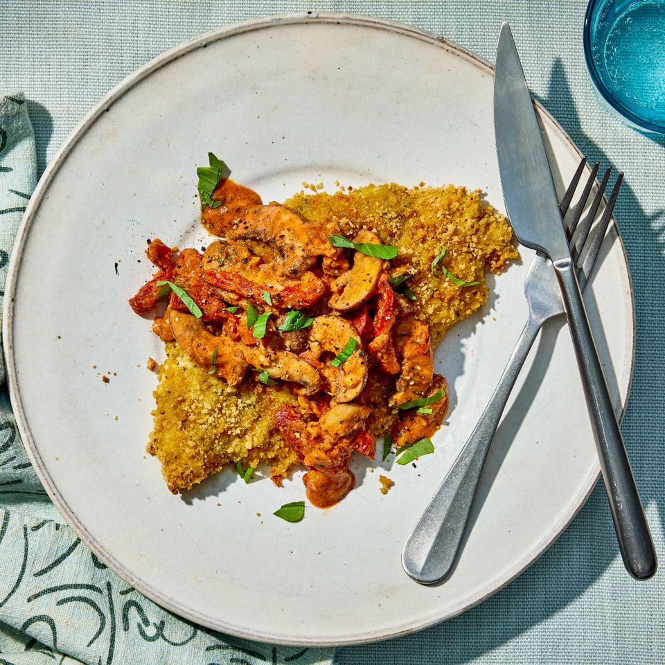 a recipe photo of the Chicken Cutlets with Creamy Mushroom & Sundried Tomato Sauce Credit: Photographer: Morgan Hunt Glaze, Food Stylist: Margaret Monroe Dickey, Prop Stylist: Julia Bayless