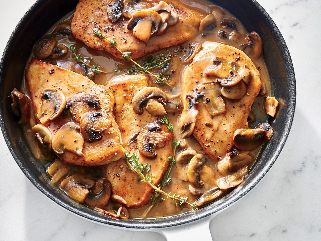 Quick Chicken Marsala recipe cooking in a skillet Credit: Caitlin Bensel