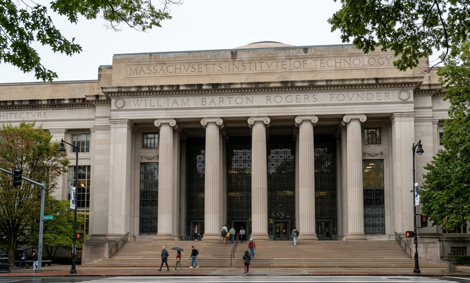 People walk outside Building 7, the main entrance to the Massachusetts Institute of Technology (MIT), on an overcast autumn day in Cambridge, Massachusetts, Oct, 2025. Photo from the universitys Facebook page