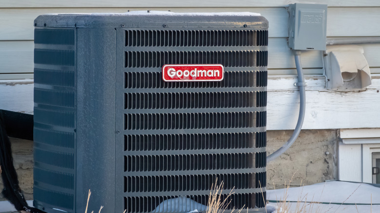 A Goodman air conditioning unit outdoors.