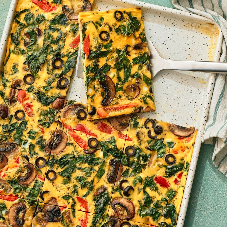 A recipe image of Sheet-Pan Veggie & Egg Breakfast Credit: Photographer: Greg Dupree, Prop Stylist: Claire Spollen, Food Stylist: Chelsea Zimmer