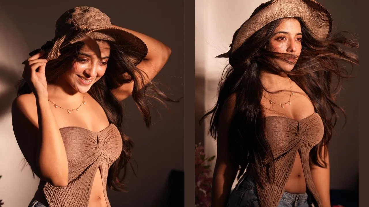 In the picture, the actress is wearing a big brown netted cap, which is making her look even more attractive. This cap has netted cloth, which is further enhancing his look.