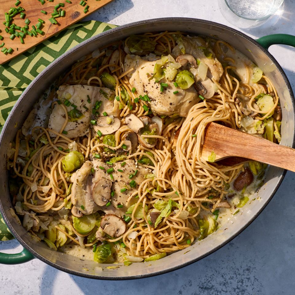 an image of the Creamy Chicken, Brussels Sprouts & Mushrooms One-Pot Pasta Credit: Photographer: Jake Sternquist, Food Stylist: Holly Dreesman, Prop Stylist: Natalie Ghazali