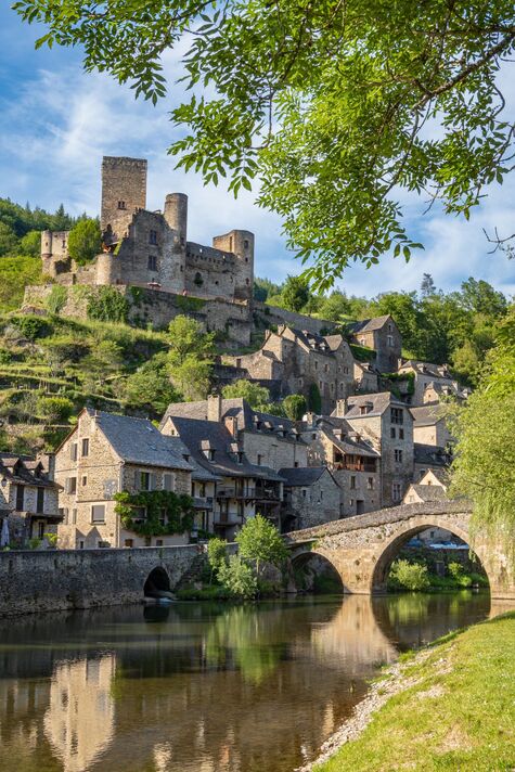 The village of Belcastel, its castle and its medieval bridge, vertical framing - France The village of Belcastel, its castle and its medieval bridge, vertical framing - France