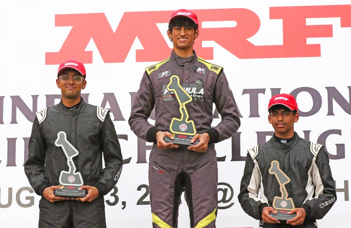 MRF F2000 race winner Saishiva Sankaran (centre) flanked by Aditya Patnaik (left, second) and Swarnav Das (third).
