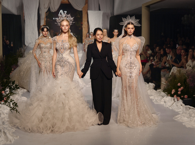Designer with the model at the end of the show. Photo courtesy of Kim Couture
