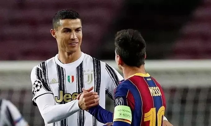 Cristiano Ronaldo shakes hands with Lionel Messi during the match between Juventus and Barcelona in the Champions League at Camp Nou, Barcelona, Spain, on Dec. 8, 2020. Photo by Reuters