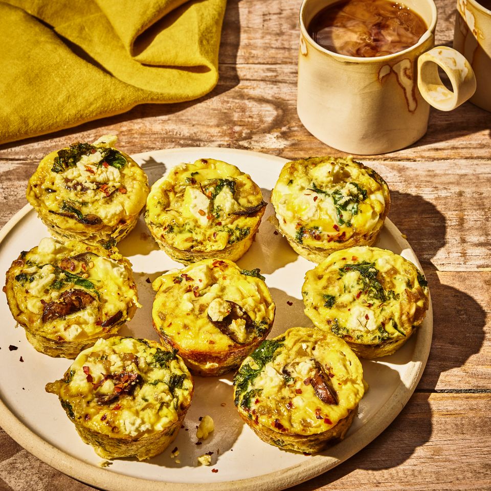 photo of Mini Crustless Quiches served on a plate with a mug of coffee Credit: Photographer: Morgan Hunt Glaze, Food Stylist: Margaret Monroe Dickey, Prop Stylist: Priscilla Montiel