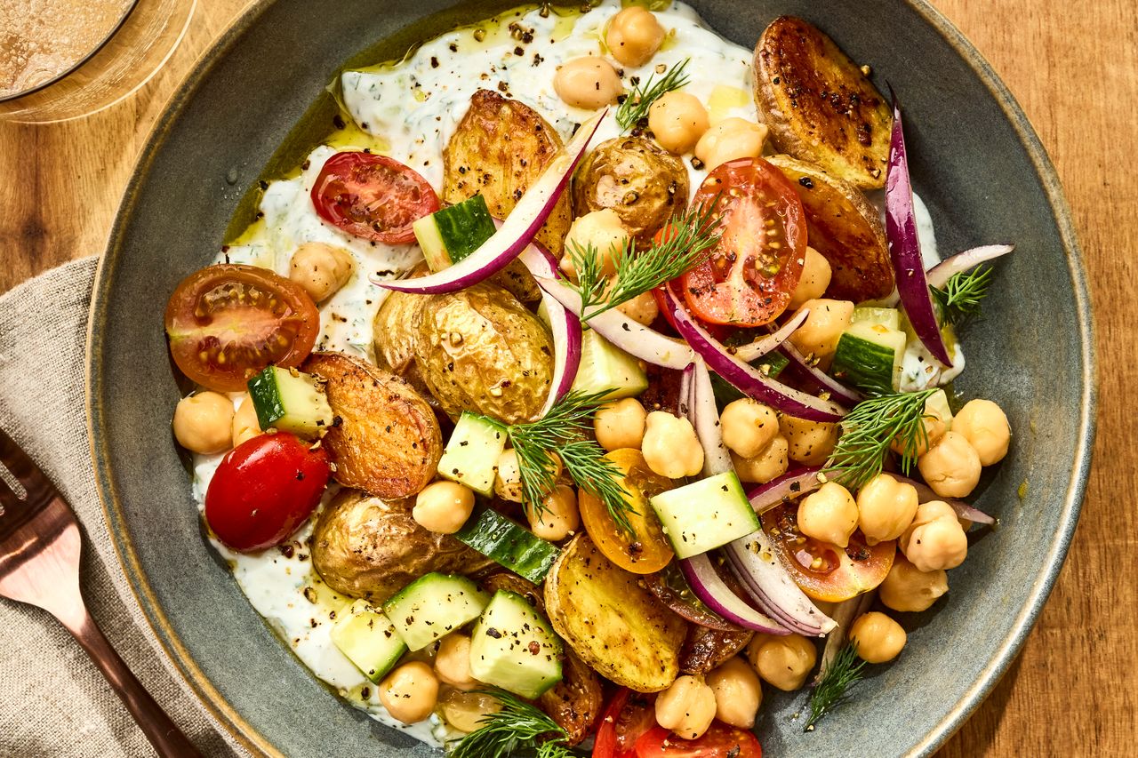 an image of the Roasted Potato Tzatziki Bowl Credit: Photographer Victor Protasio, Food Stylist Chelsea Zimmer, Prop Stylist Christina Daley